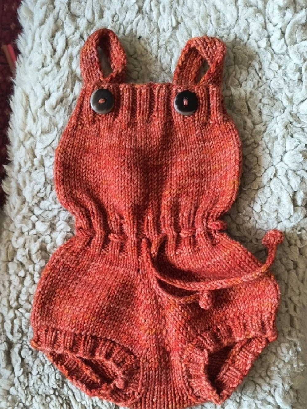 Misha And Puff Hand-Knit Baby Romper in Burnt Orange - Picture 2 of 3